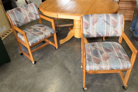 ROUND MAPLE DINING TABLE WITH JACK KNIFE LEAF AND FOUR OAK ROLLING ...