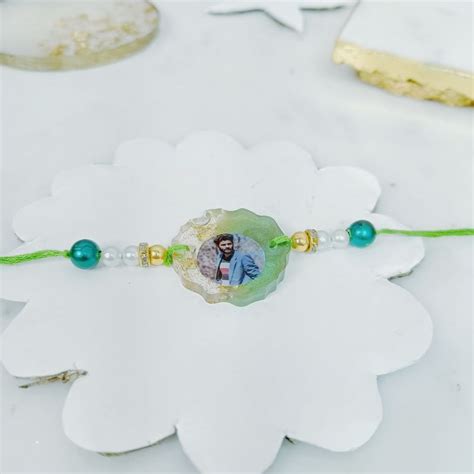 Send Infinite Memories Resin Rakhi Online