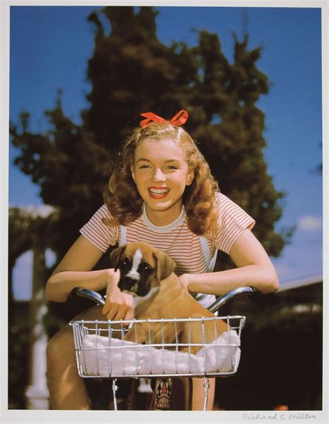 Norma Jeane Dougherty with a puppy in a basket, mid 1940s : r/wholesomepics