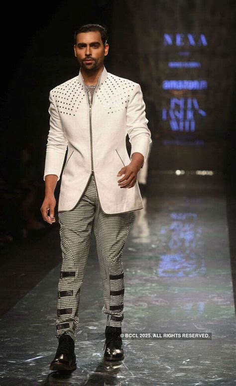 Aman Bedi looks stunning as he walks the ramp for designer Pawan ...