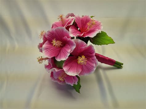Hot pink hibiscus wedding bouquet, perfect for the beach!! From www ...