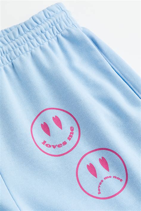 Printed joggers - Light blue/Loves me - Ladies | H&M IN