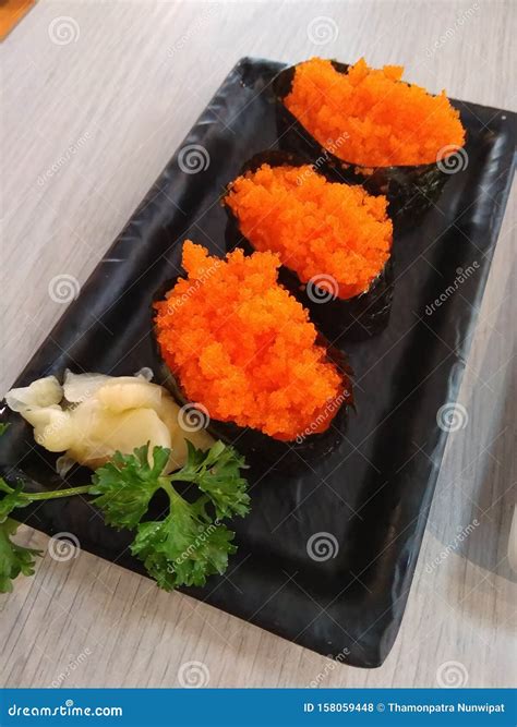 Tiny Orange Fish Eggs Onigiri with Preserved Ginger Stock Photo - Image ...