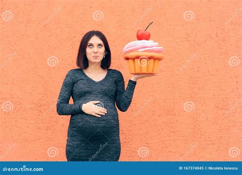 Pregnant Woman Craving Sweets Holding Huge Cupcake Stock Image - Image ...