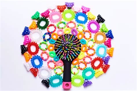 Bright multi colored comb in a circle of small colorful hairpins and ...