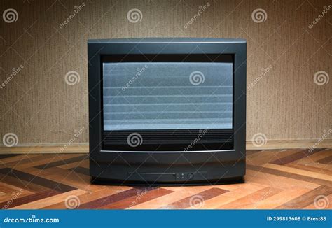 A Vintage TV with Screen Noise Stands on the Floor, Design of an Old ...