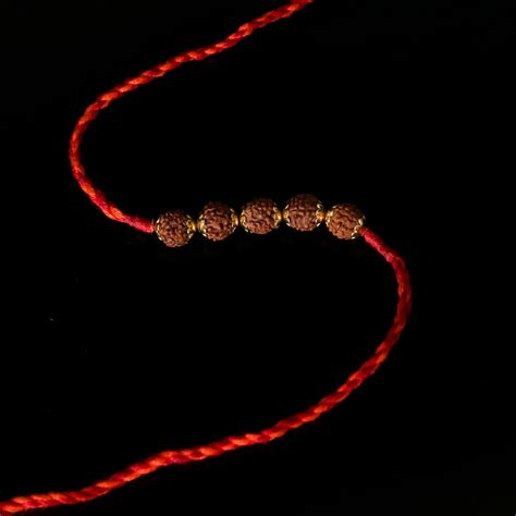 Rudraksha Golden Rakhi – Pratha - Jewellery Studio