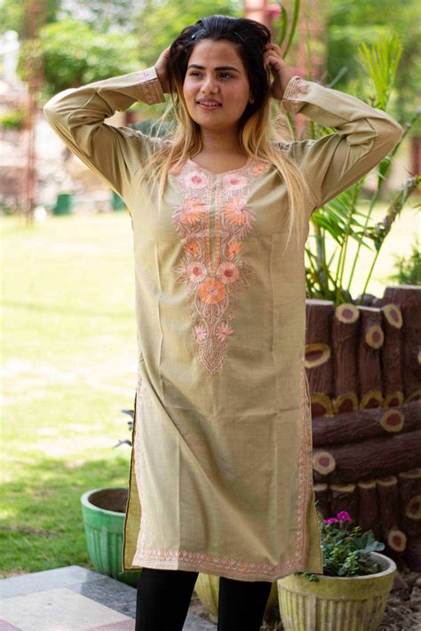 Olive green colour cotton kurti with beautiful aari embroidery gives