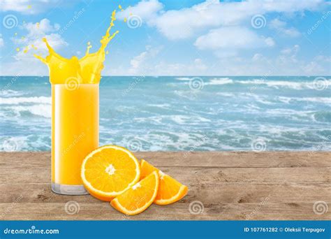 Orange Juice on the Beach Table Stock Photo - Image of beverage, glass ...