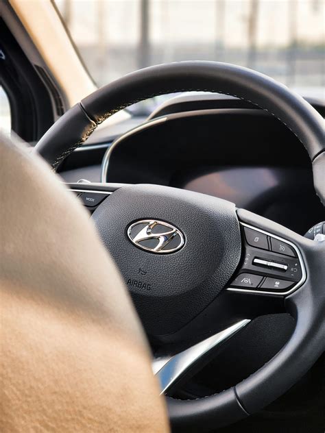 A close up of a steering wheel of a car photo – Free Steering wheel Image on Unsplash