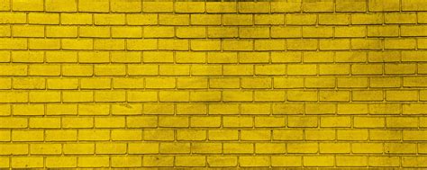 Download wallpaper 2560x1024 wall, brick, yellow, paint, texture ...