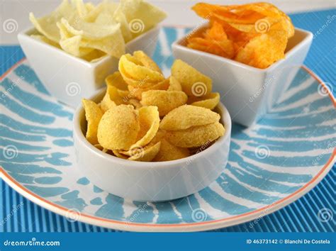 Different Types of Chips on a Table Stock Photo - Image of potatoes ...