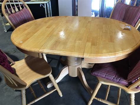 ROUND PINE KITCHEN TABLE WITH HIDDEN LEAF (41" DIAMETER) & 4 PINE CHAIRS