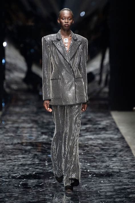 A short history of the trouser suit | Vogue fashion encyclopaedia ...