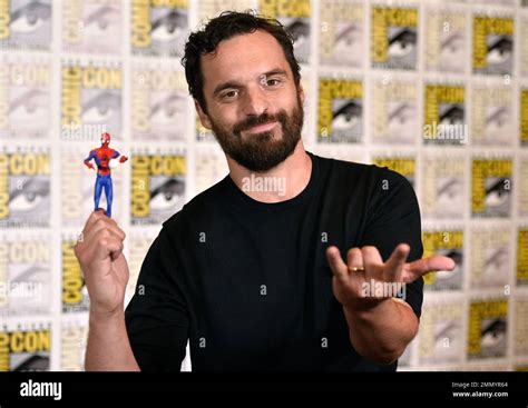 Jake Johnson makes a Spider-man gesture and holds a figurine at the ...