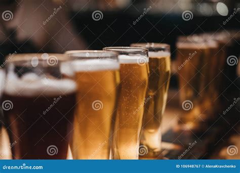 Close Up of a Rack of Different Kinds of Beers, Dark To Light, on a ...