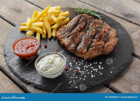 Beef Steak with French Fries and Sauce Stock Image - Image of dining ...