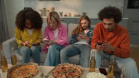 Multiracial friends multiethnic diversity people gadgets addict together using mobile phones ...