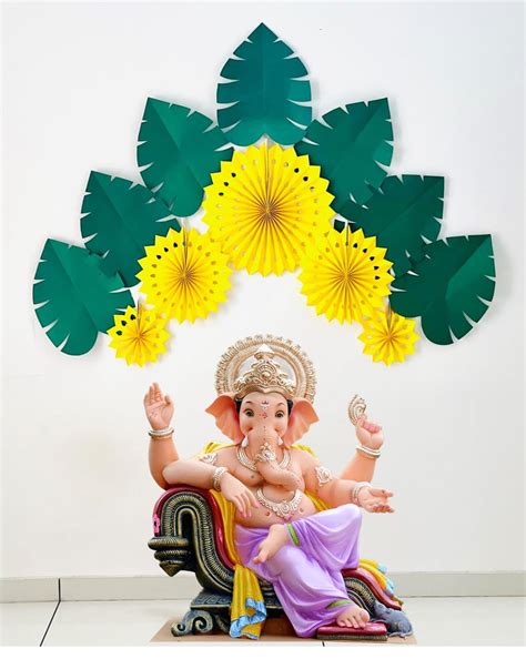 Buy Tapudi ganpati Decoration Items, Yellow Paperfans with Green Leaves ...