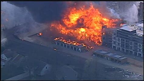 Crews mop up after massive suburban Kansas City fire
