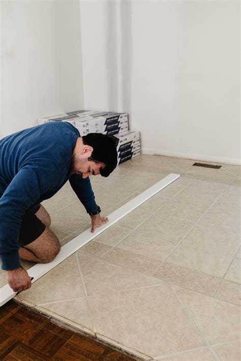 How to Install a Herringbone LVP Floating Floor Over Tile - DESIGN IT ...