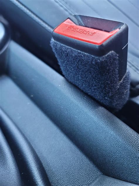 Why is there velcro around my seat belt latch? : r/MINI