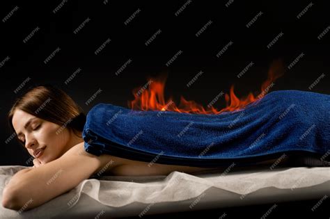 Premium Photo | Fire burning on back therapy massage of girl Fire ...