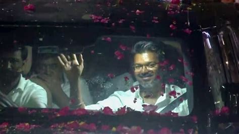 Watch: Vijay's supporters surround his car, shower petals as TVK makes ...
