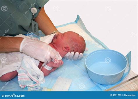 Newborn Baby s First Bath stock image. Image of medical - 4571703