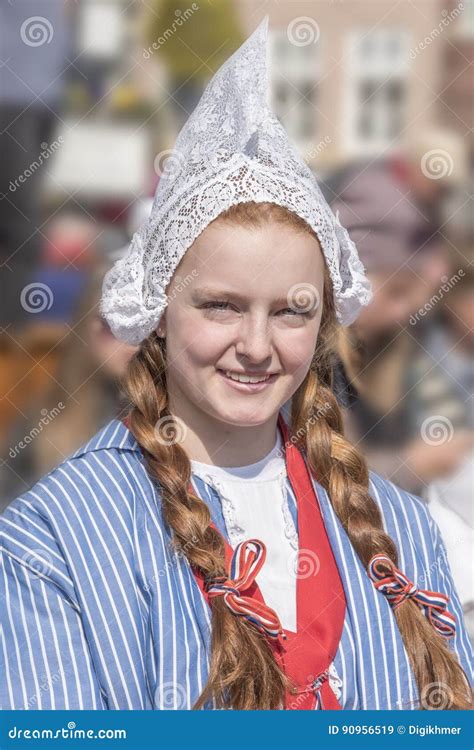 Young Dutch Woman Raking In Garden Royalty-Free Stock Photography ...