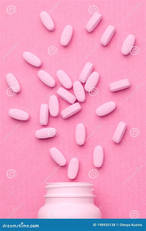 KIEV, UKRAINE - OCTOBER 14, 2020: Large Pink Oval Tablets. Pills on a ...