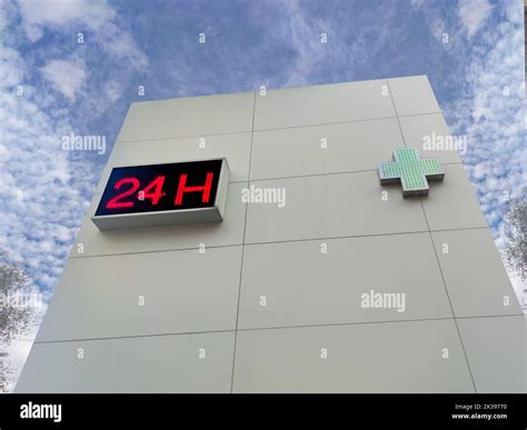 24-hour pharmacy wall. Building isolated over blue sky Stock Photo - Alamy