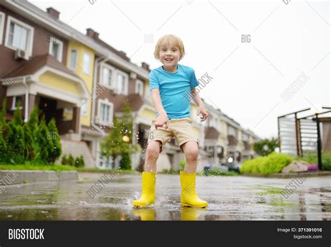Little Boy Wearing Rain Boots