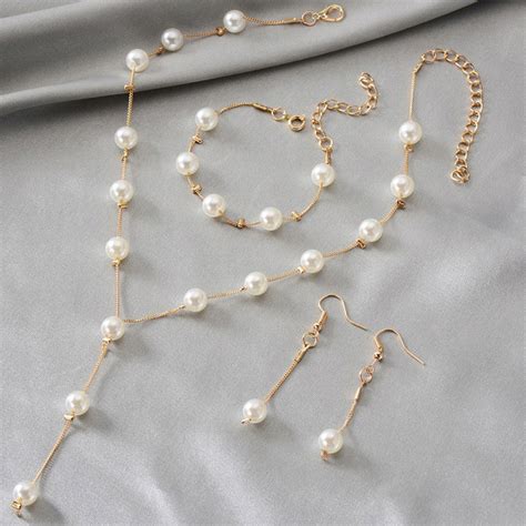 Buy Gold Plated White Pearl Studded Multi-Piece Single-Strand Jewellery ...