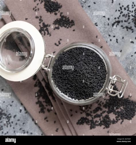 Indian spice Black cumin (nigella sativa or kalonji) seeds in glass jar ...