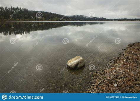 Calm Hauser Lake in North Idaho Stock Photo - Image of overcast, cloud ...