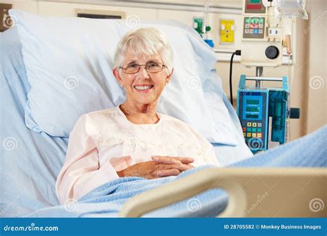 Portrait of Senior Female Patient Relaxing in Hospital Bed Stock Photo ...