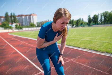 Premium Photo | Injury and pain in the chest of a female runner a woman suffers from chest pains ...