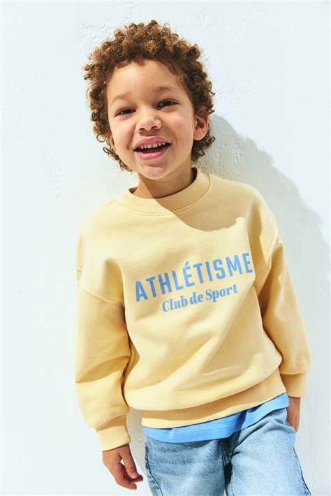 Printed crew-neck sweatshirt - Yellow/Athlétisme - Kids | H&M IN