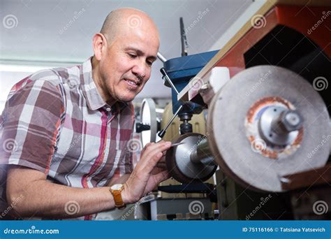 Professional Knife and Scissors Sharpening on Machine Stock Photo ...