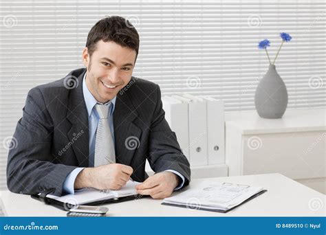 Businessman Working at Desk 的图像结果