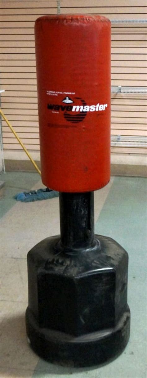 Lot - Wave Master Red Adjustable On Floor Punching Bag