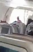 Image result for Passenger arrested for opening plane door