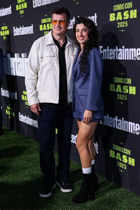 ‘Superman’ Star Nathan Fillion Kisses Actress Tania Raymonde at Disneyland