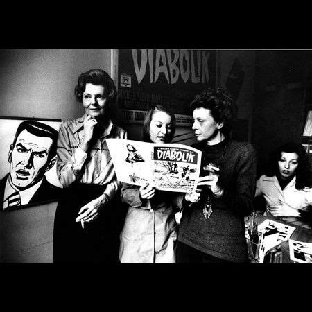 Group of People Standing in Front of Wall with Pictures