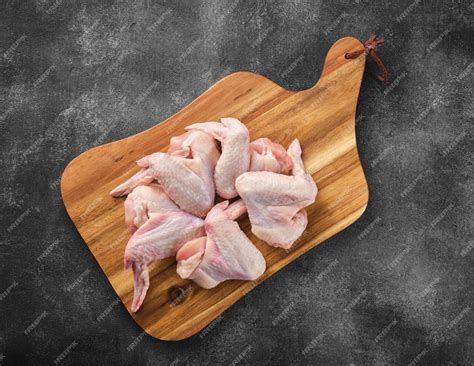Premium Photo | Uncooked chicken wings raw meat raw chicken wings