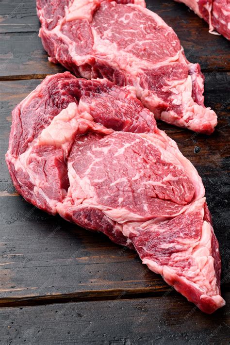 Premium Photo | Black angus prime beef rib eye steak marbled meat on ...