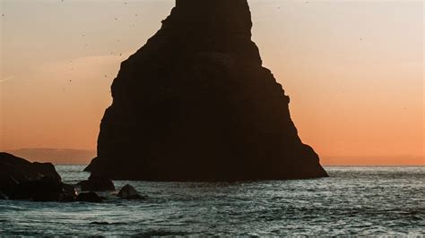 Download wallpaper 1920x1080 rock, sea, coast, water, dusk full hd ...