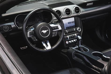 Rent Ford Mustang Black in Dubai - Convertible - Octane.Rent