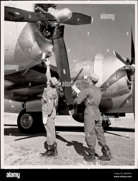 Airmen checking plane, Indian Springs, Nevada, April 20, 1952, by the ...